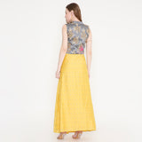 Grey embroidered top and yellow skirt