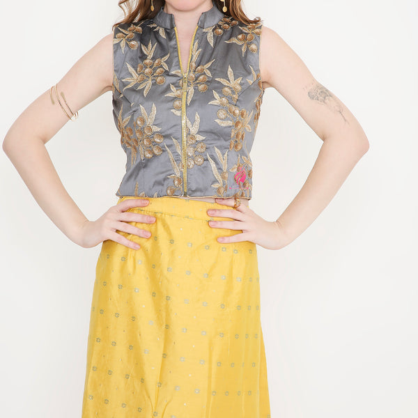 Grey embroidered top and yellow skirt