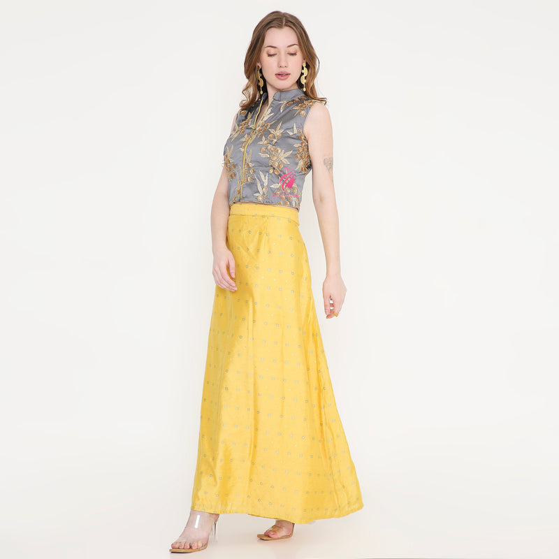 Grey embroidered top and yellow skirt