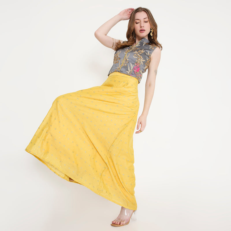 Grey embroidered top and yellow skirt